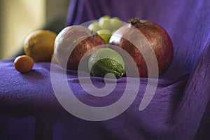Still life of fruits on a purple background