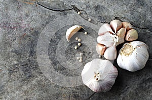 Still life of Garlic cloves raw food on old table backgrounds above