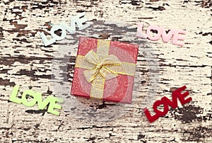 Still life of gift box on grunge wood background