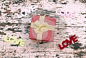 Still life of gift box on grunge wood background