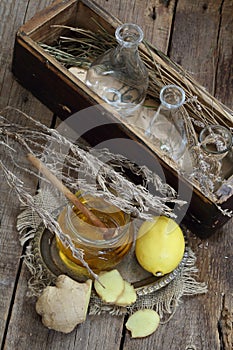 Still life with ginger,lemon,honey and herbs de Provence