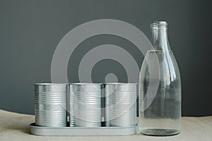 Still life of glass bottle and metal pot