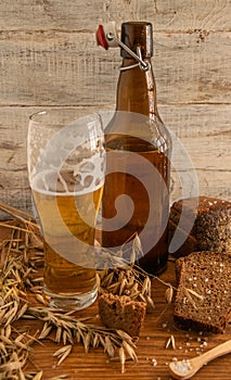 Still life from a glass and bottles with beer