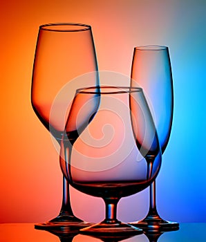 Still life with glass objects on a multicolored background