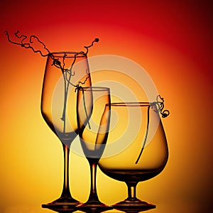 Still life with glass objects on a multicolored background