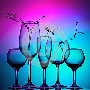 Still life with glass objects on a multicolored background