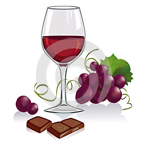 Still life with a glass of wine, grapes and chocol