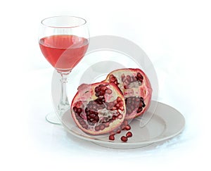 Still-life with a glass of wine and pomegranate