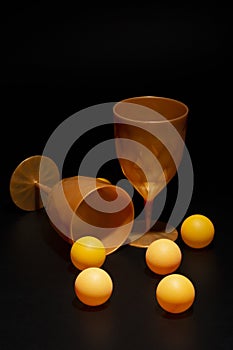 Still life with glasses and scattered balls