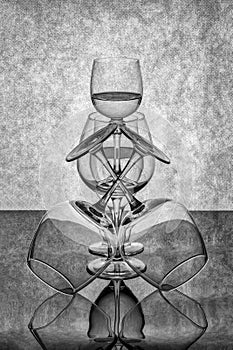 Still life with glassware on a reflective surface