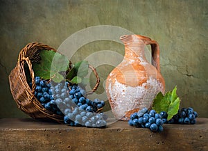 Still life with grapes on a basket