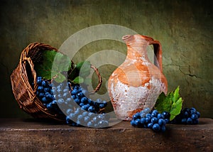 Still life with grapes on a basket photo