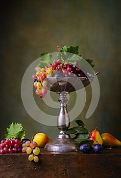 Still life with grapes and plums