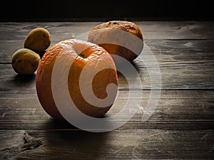 Still life with group of rotten fruits