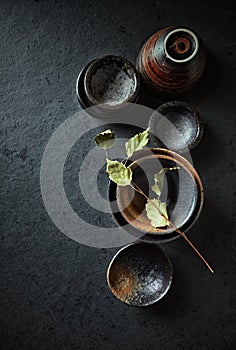 Still life with hand crafted japanese ceramic on stone background