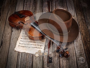 Still life with hat, violin and coins