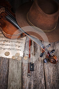 Still life with hat, violin and coins