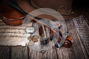 Still life with hat, violin and coins