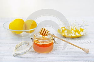 Still life with honey and lemons