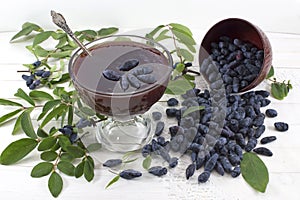 Still life with honeysuckle berries and jam