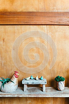 Still life image of Wooden bench and small birds with plant pot