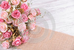 still life interior decoration pink rose flower on rustic wooden