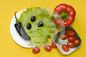 Still life of jalapeno pepper,  bell pepper, tomato cherry, on yellow background