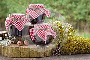 Still life with jars of jam and decoration in rustic style
