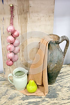 Still life with jug and red onions