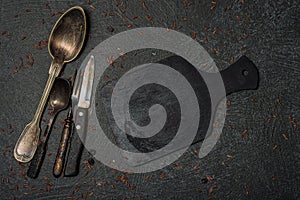 Still life kitchen- fork, spoon, knife, board