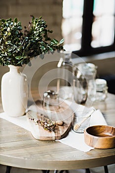 Still life, kitchen table, wooden board, vase, honey