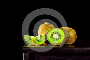 Still life, Kiwi fruit on the table and black background, lowkey