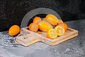 Still life of kumquat on a gray background, top