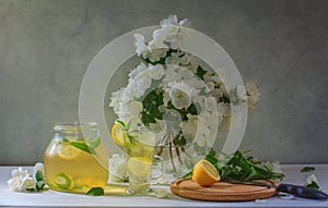 Still life with lemonade and jasmine flowers
