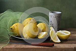 Still life with lemons and green gauze photo