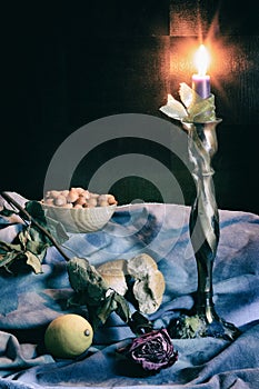 Still life with lighting candle