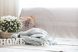 Still life in the living room with wooden inscription home