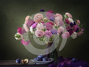 Still life with luxurious bouquet of autumn asters