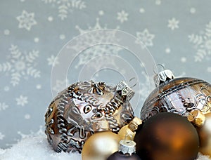 Still life made from Christmas decorations laying in the snow