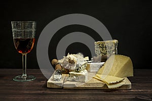Still life with Manchego cured sheep cheese and French blue cheeses