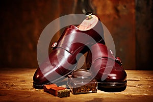 Still life with men`s leather shoes and accessories for shoes ca