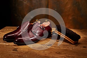 Still life with men`s leather shoes and accessories for shoes ca
