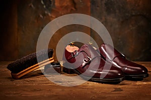 Still life with men`s leather shoes and accessories for shoes care