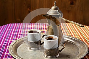 still life with a middle eastern coffee set, on wooden table