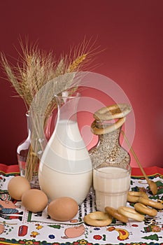 Still life with milk, cereals, grains and eggs.