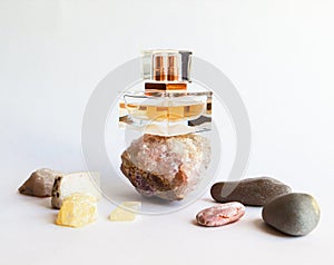 Still life with narure objects stones and parfume