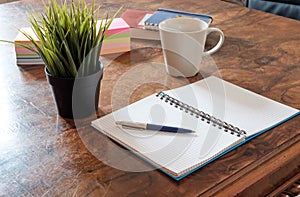 Still life of office supplies on wooden table