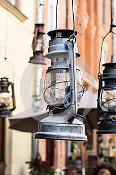 Still life of old hurricane lamp. Vintage lamp. Kerosene lamp. Old-fashioned equipment. Ancient decor. Retro gas lamp.