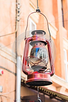 Still life of old hurricane lamp. Vintage lamp. Kerosene lamp. Old-fashioned equipment. Ancient decor. Retro gas lamp.