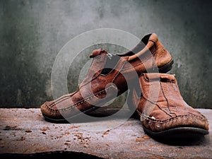 Still life old Leather shoes and belt. It more of dirty and sha